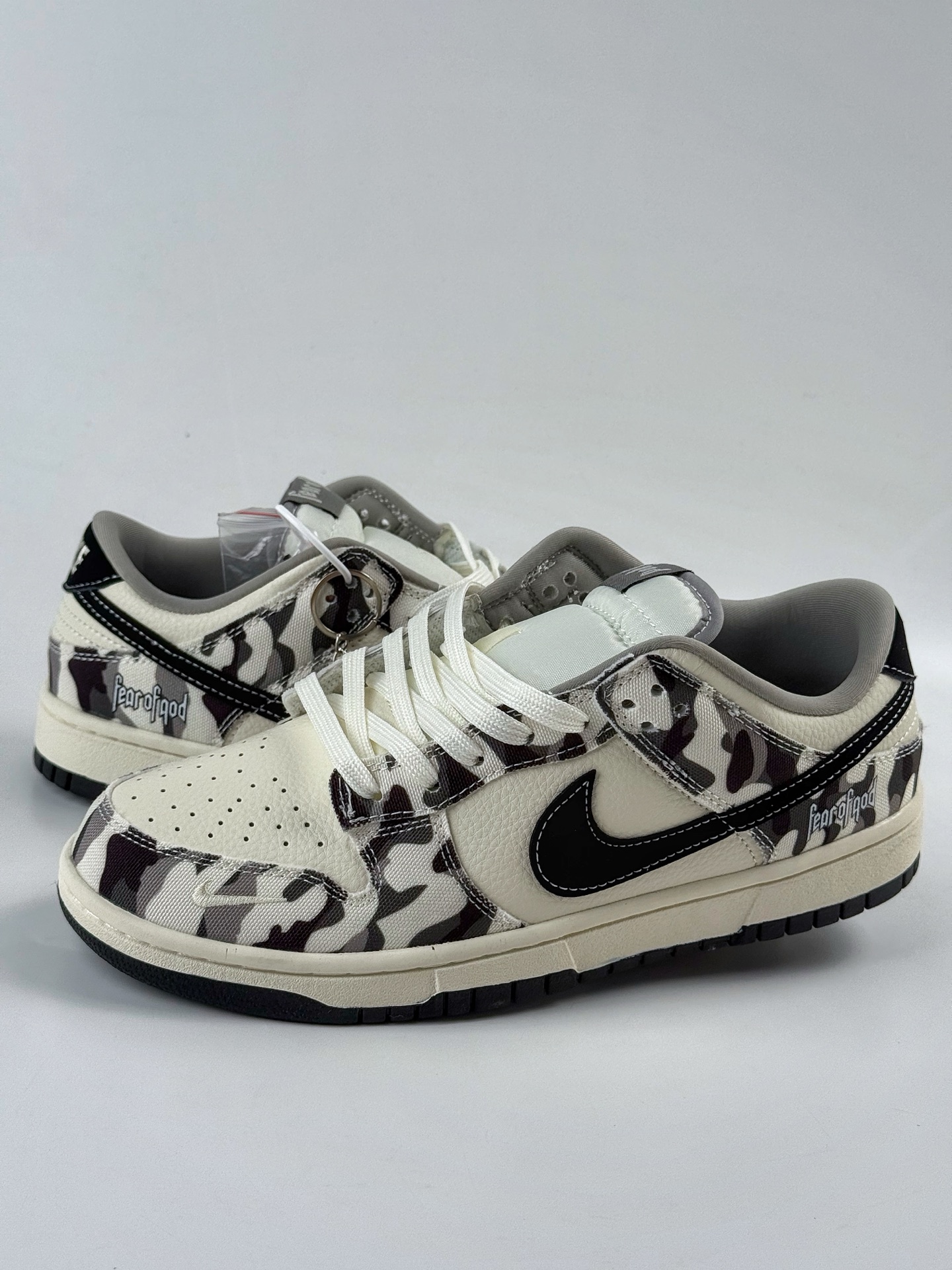 Nike SB Dunk Low x Fear of God gray and white swoosh