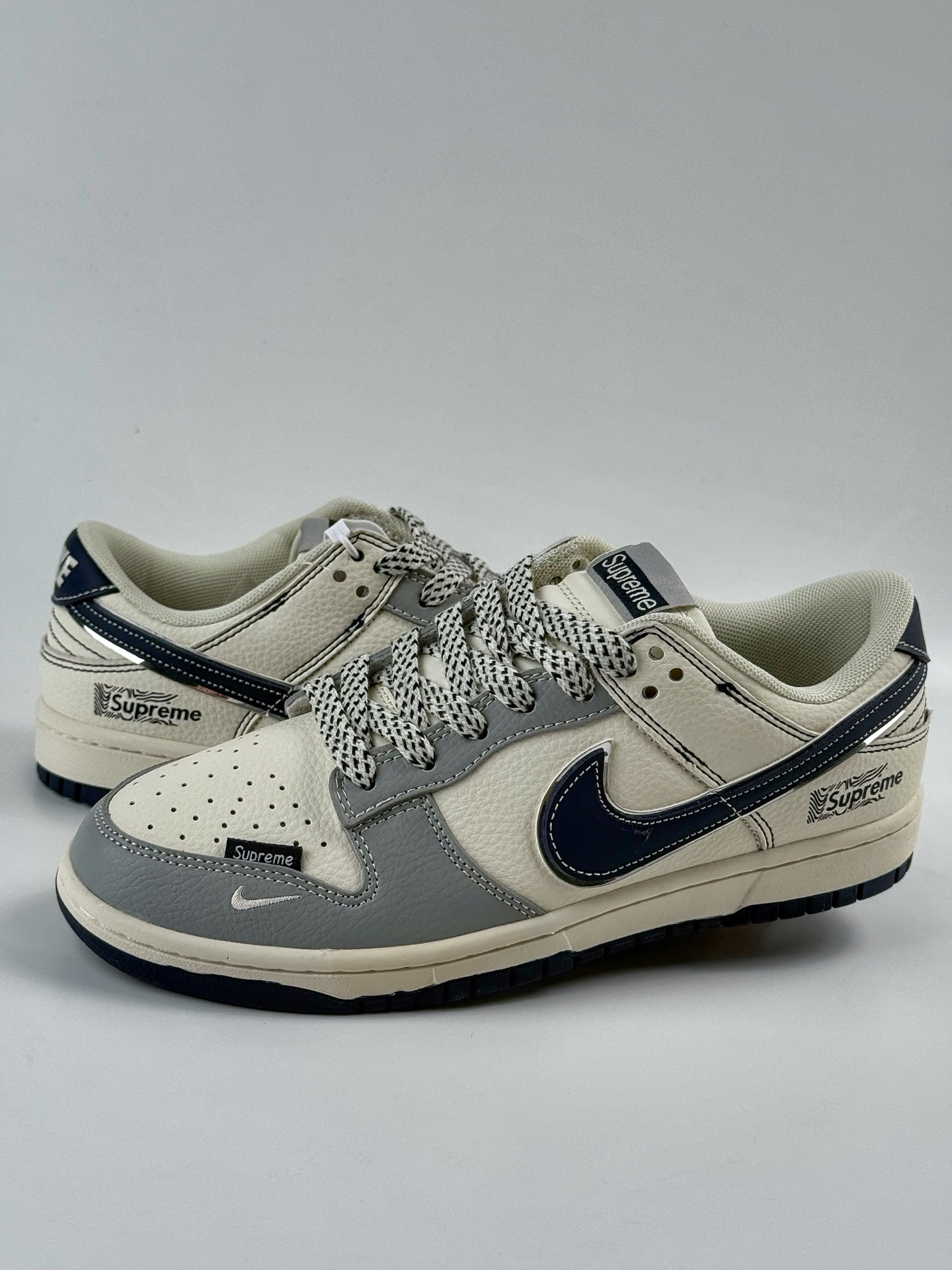 Nike SB Dunk Low x Supreme Gray, White, Black and White Swoosh Star